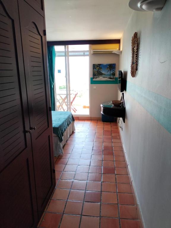 Postel nebo postele na pokoji v ubytování Appartements vue mer - Résidence de la baie - Tartane