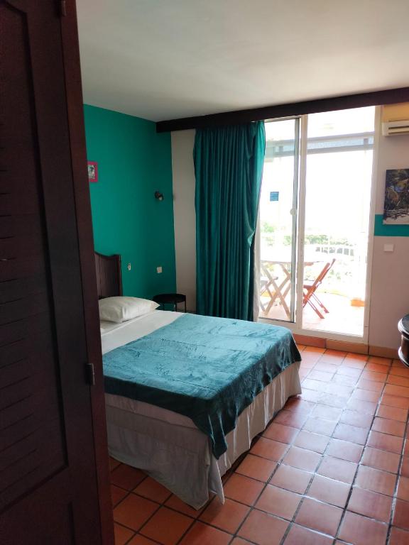 Postel nebo postele na pokoji v ubytování Appartements vue mer - Résidence de la baie - Tartane