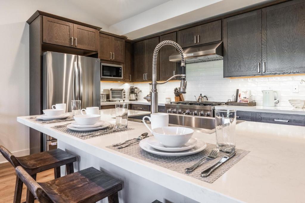 a kitchen with a counter with dishes on it at Creekhouse 1583 in Mammoth Lakes