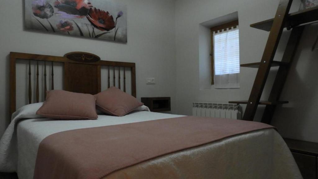 Postel nebo postele na pokoji v ubytování Casa Cosculluela