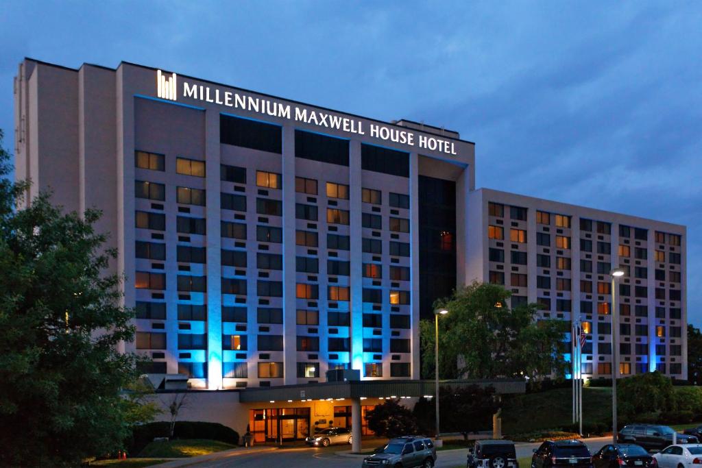 a large building with blue lights in a parking lot at Millennium Maxwell House Nashville in Nashville