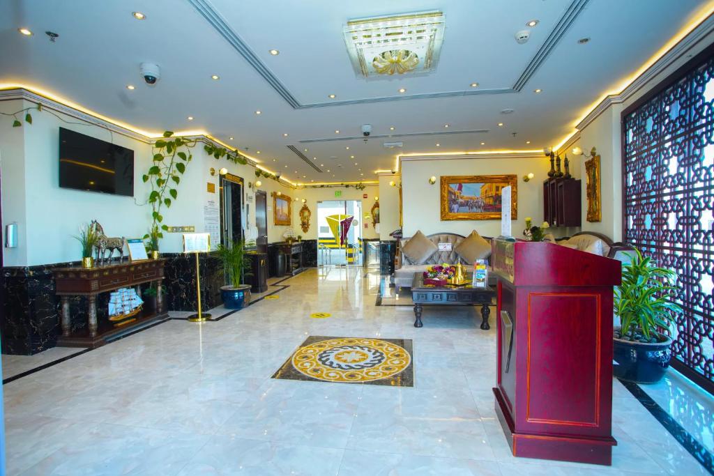 TV a/nebo společenská místnost v ubytování La Villa Palace Hotel