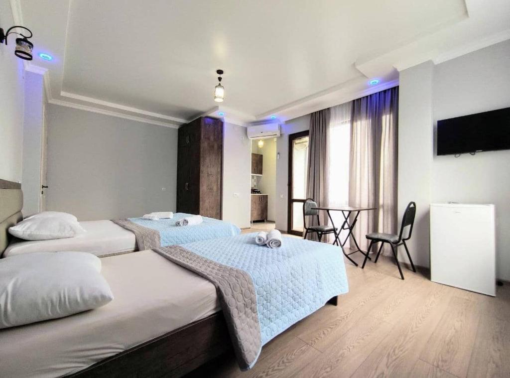 Ένα ή περισσότερα κρεβάτια σε δωμάτιο στο Elgabi Hotel Kobuleti