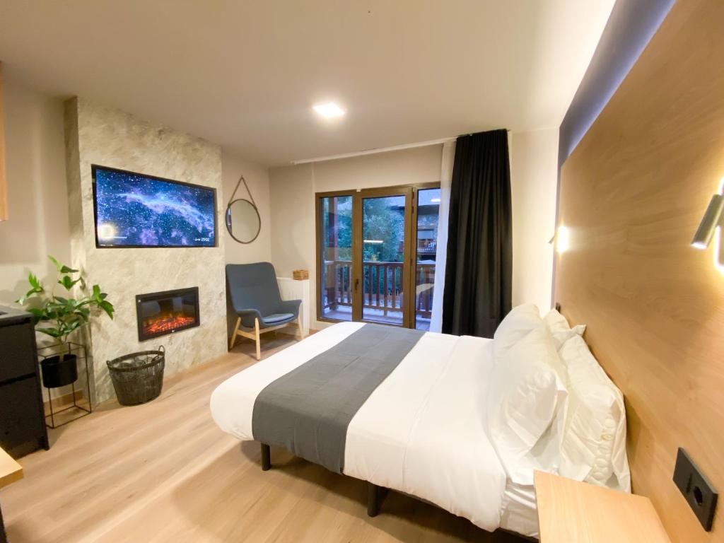 Voodi või voodid majutusasutuse Modern Blue Studio En Valle De Incles - Parking Gratis l by BonesVacances toas