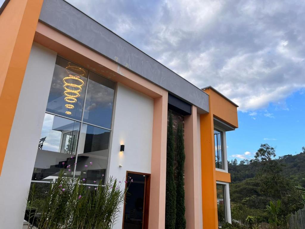 a building with a sign on the side of it at Espectacular Quinta privada in Viotá