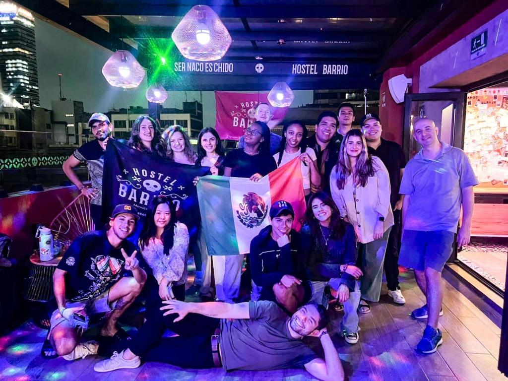 a group of people posing for a picture at a party at Barrio Downtown Mexico City Hostel in Mexico City