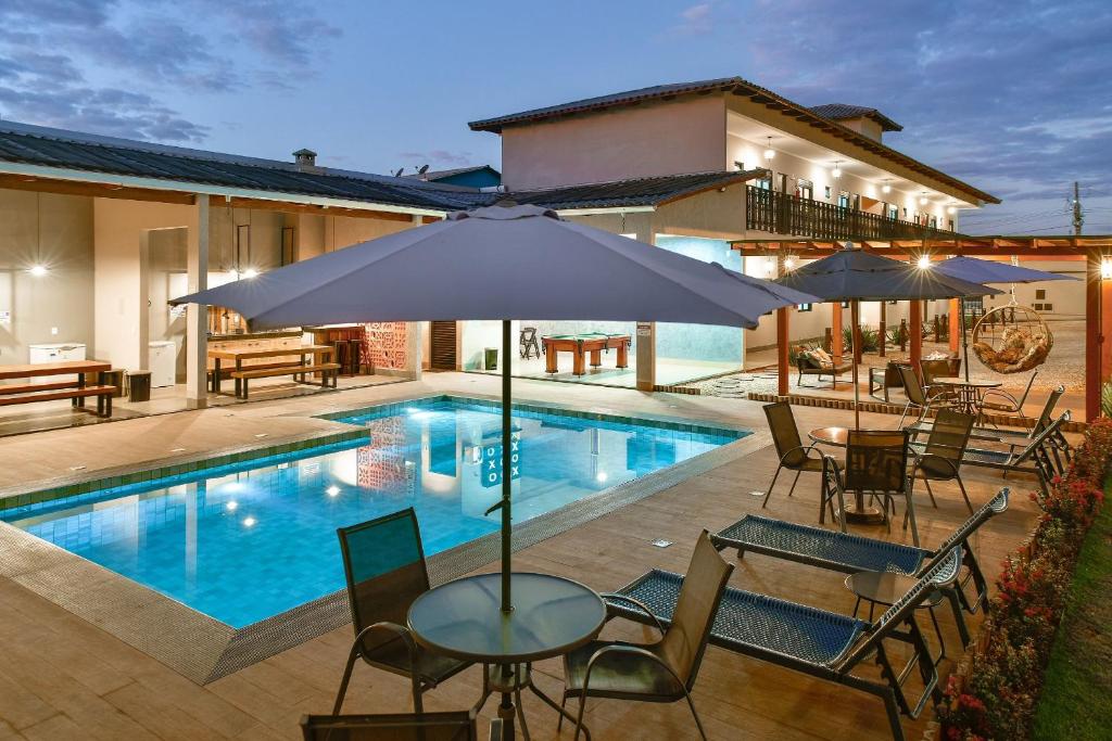 Kolam renang di atau dekat dengan Flat Charme do Cerrado - Até 4 pessoas/Cozinha/Ar Cond./Piscina
