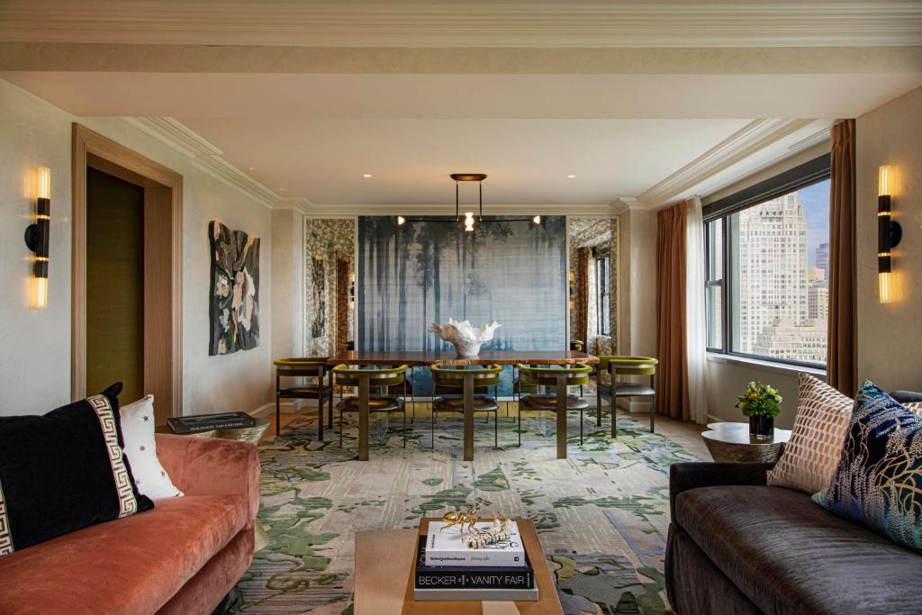a living room with a couch and a table at JW Marriott Essex House New York in New York