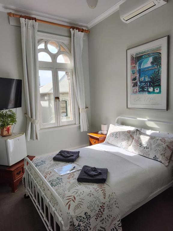 Postel nebo postele na pokoji v ubytování Fremantle Bed & Breakfast