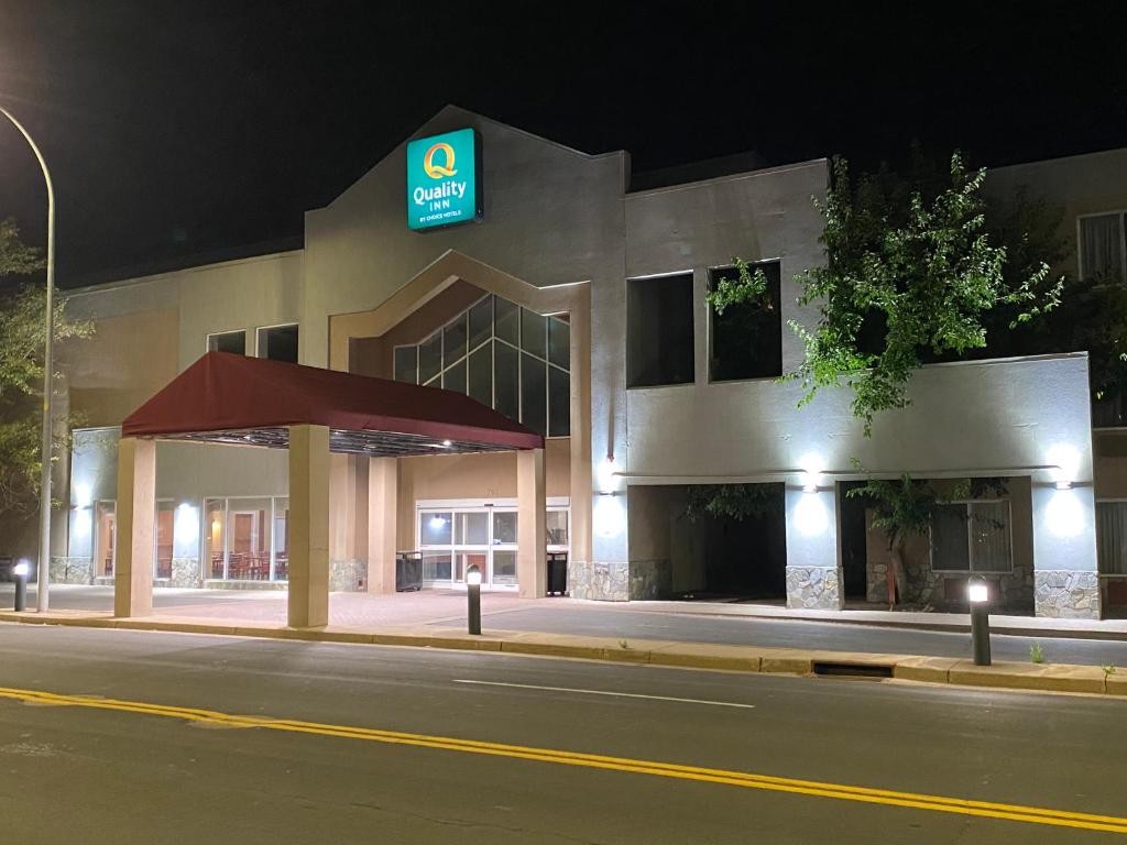 a building with a gas station at night at Quality Inn and Conference Center Greeley Downtown in Greeley