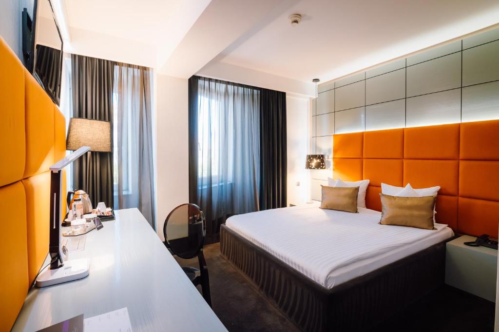 Postel nebo postele na pokoji v ubytování Plaza V Hotel