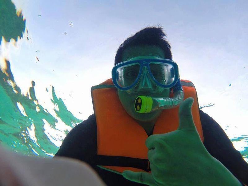 a person wearing a mask and goggles giving a thumbs up at Beach Front Calatagan Apartelle in Calatagan