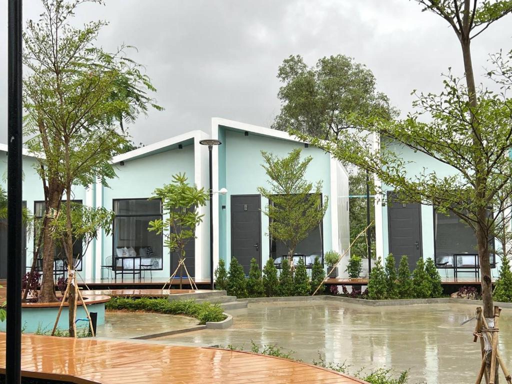 a building with a pool in front of it at Sandy Residence Sihanoukville in Sihanoukville