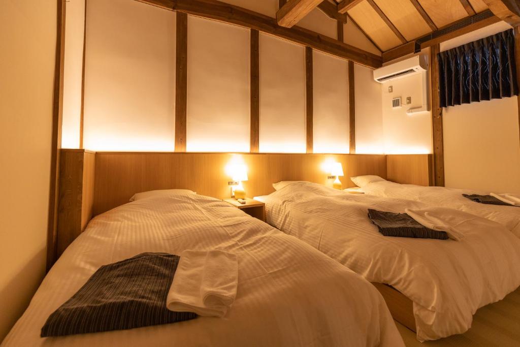 Postel nebo postele na pokoji v ubytování Classic ＆ modern SELF-STYLED HOTEL 番場おおそね