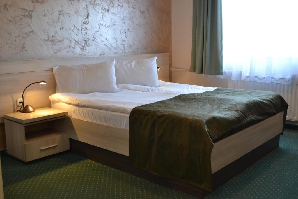 Postel nebo postele na pokoji v ubytování Apollo Wellness Club