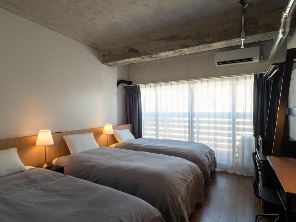 Postel nebo postele na pokoji v ubytování SEAMORE RESIDENCE