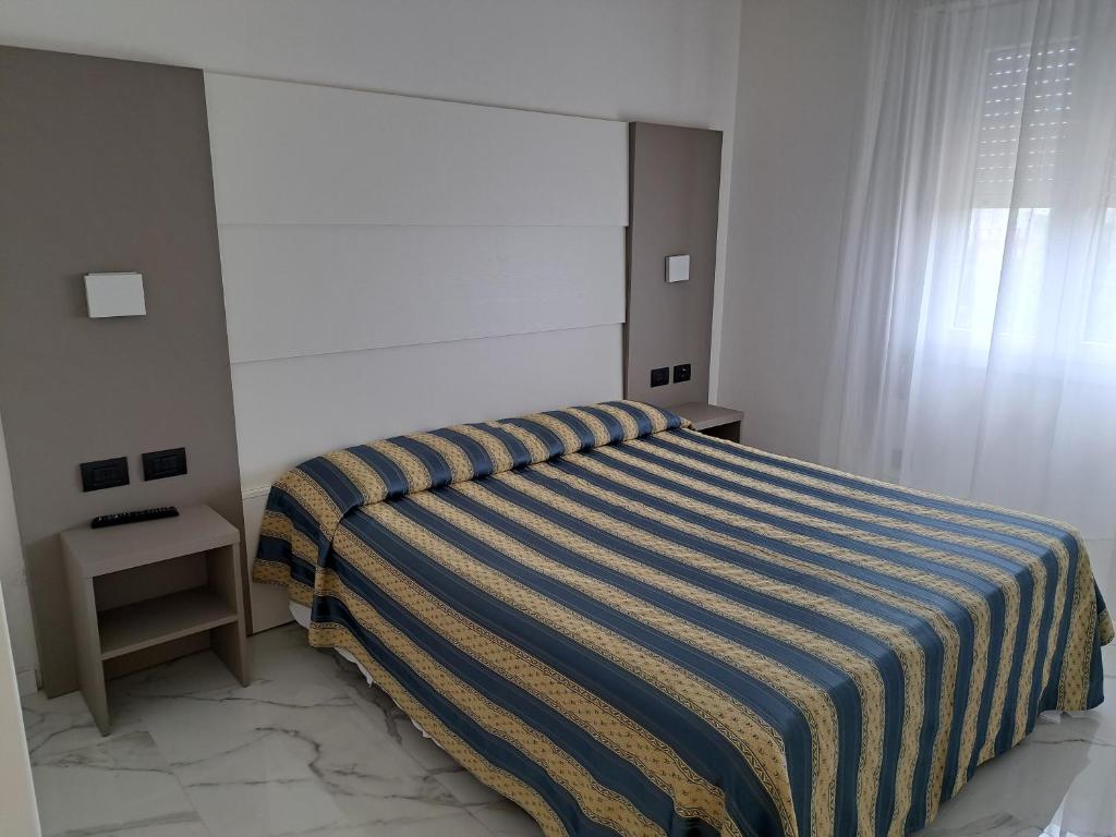 Posteľ alebo postele v izbe v ubytovaní Hotel Consuelo