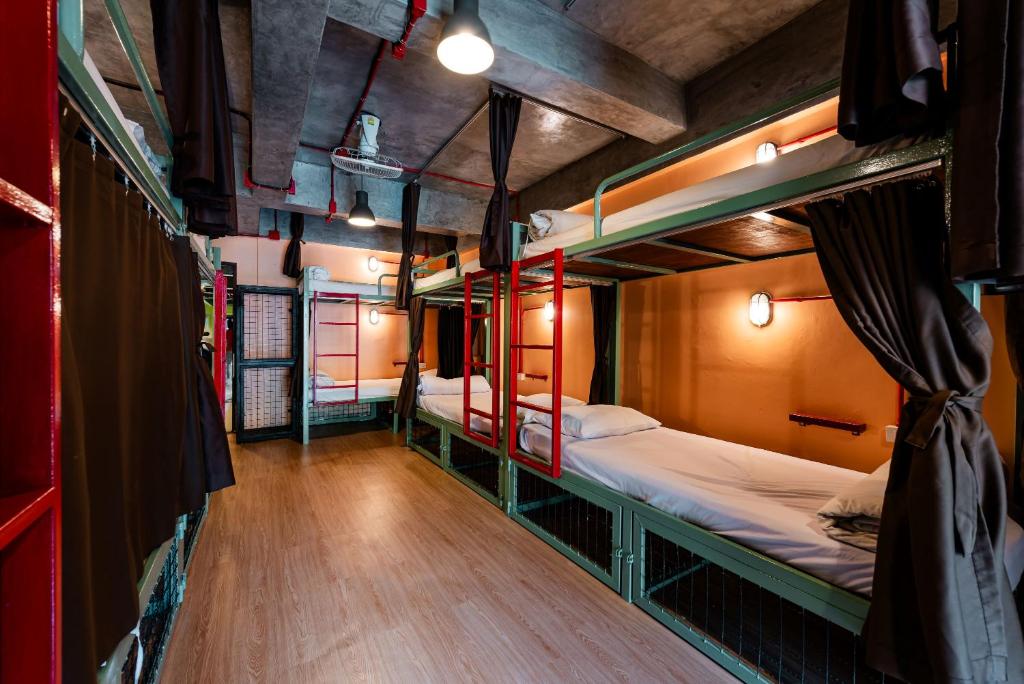 Postel nebo postele na pokoji v ubytování Sleeper Hostel