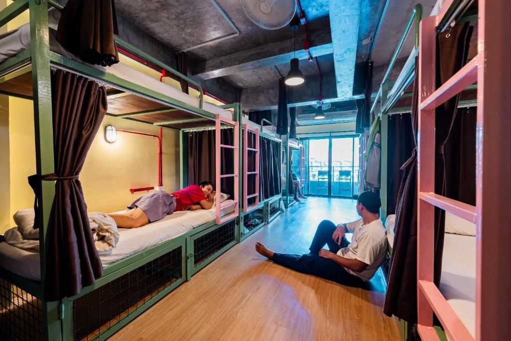 Postel nebo postele na pokoji v ubytování Sleeper Hostel
