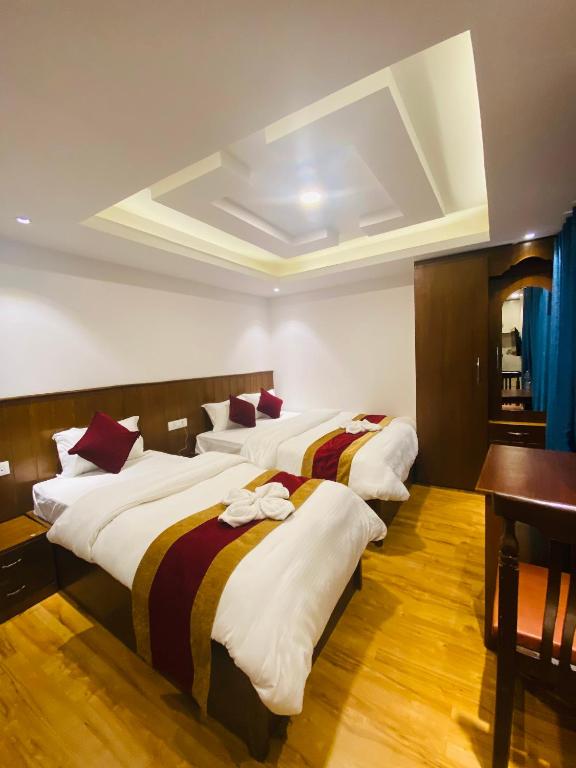 Postel nebo postele na pokoji v ubytování Hotel Abi International