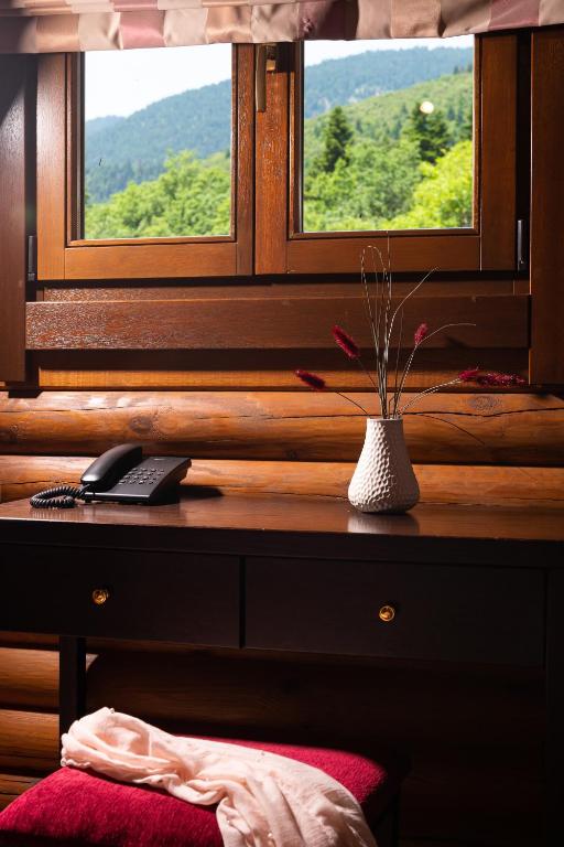 TV a/nebo společenská místnost v ubytování Natura Chalets