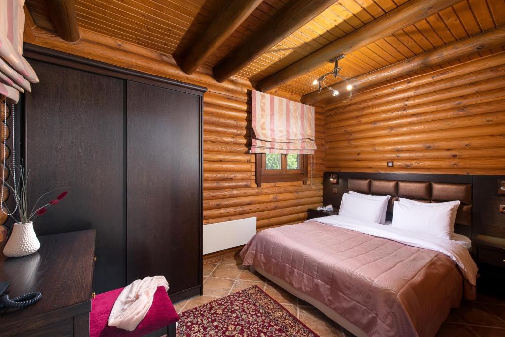Postel nebo postele na pokoji v ubytování Natura Chalets