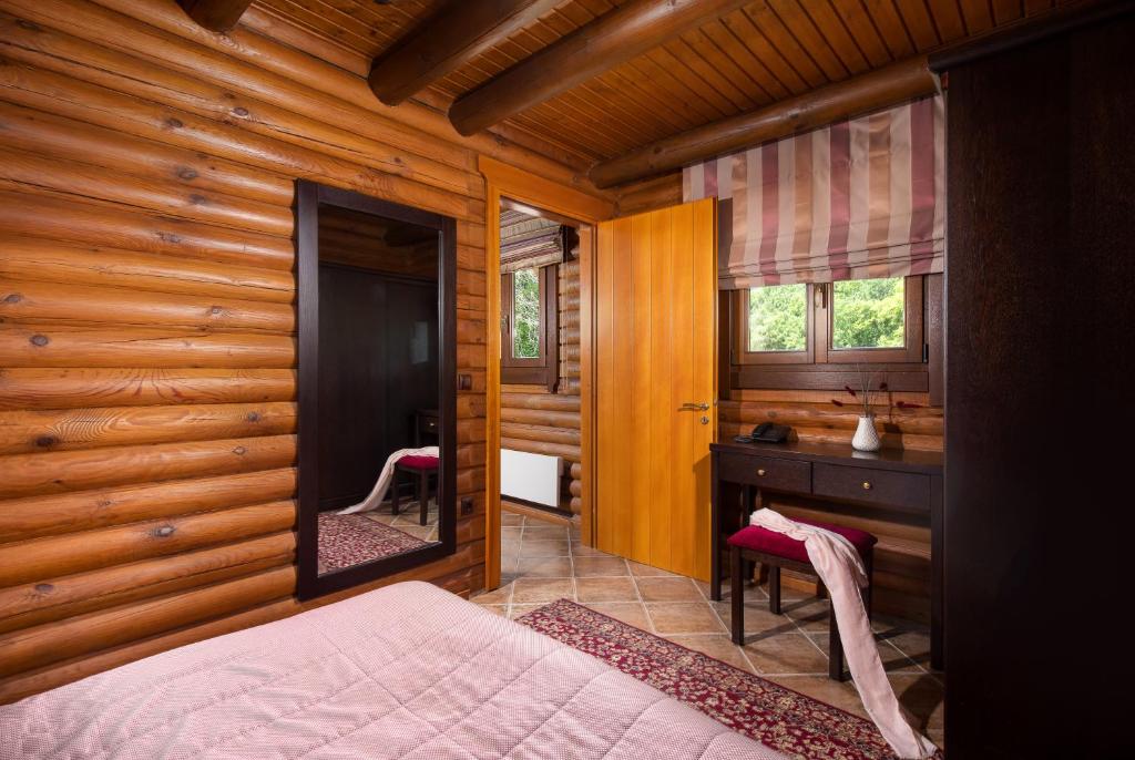 Postel nebo postele na pokoji v ubytování Natura Chalets