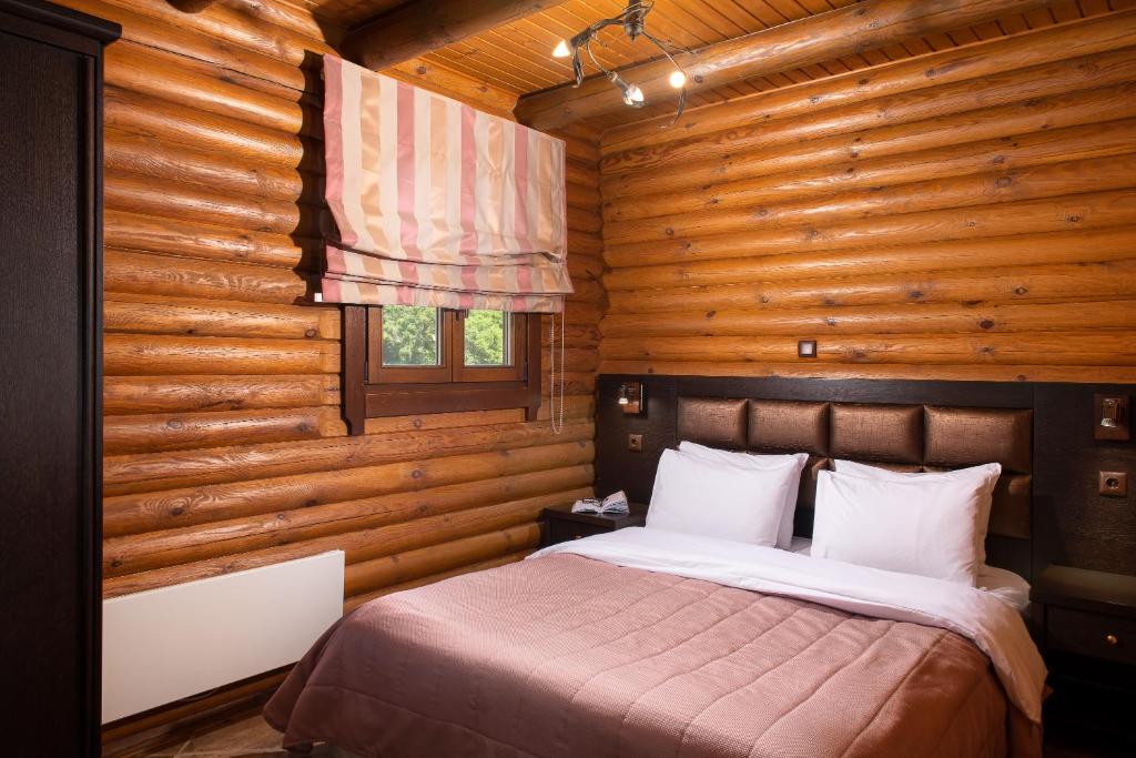 Postel nebo postele na pokoji v ubytování Natura Chalets