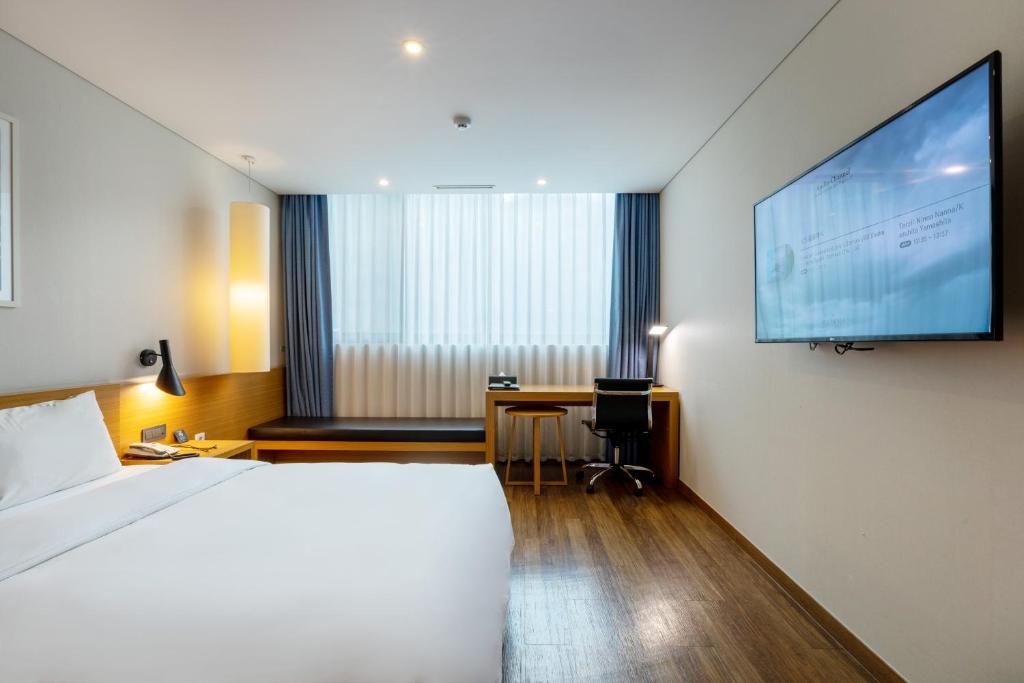 Postel nebo postele na pokoji v ubytování Mate Hotel Paju
