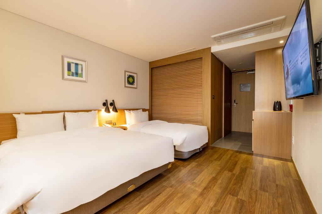 Postel nebo postele na pokoji v ubytování Mate Hotel Paju