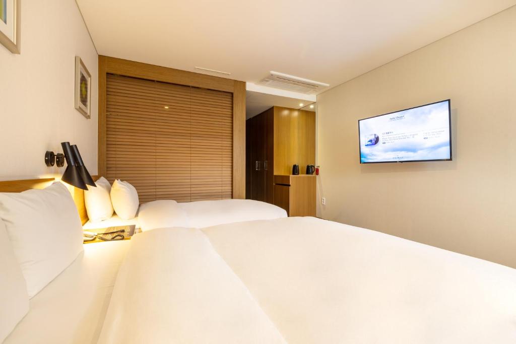 Postel nebo postele na pokoji v ubytování Mate Hotel Paju