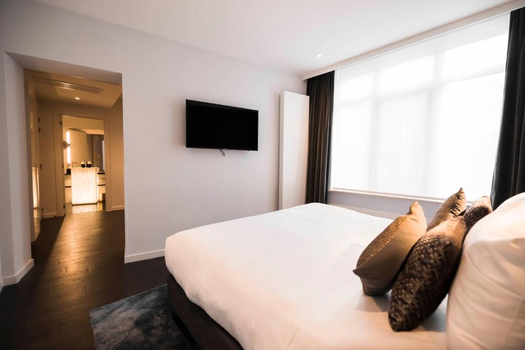 Postel nebo postele na pokoji v ubytování Boutique Hotel Sablon by CW Hotel Collection
