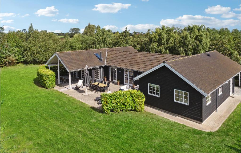an aerial view of a black house with a yard at Cozy Home In Idestrup With Sauna in Marielyst