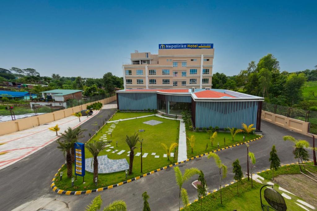 an overhead view of a building with a park at Nepalirika Hotel Biratchowk in Haraincha