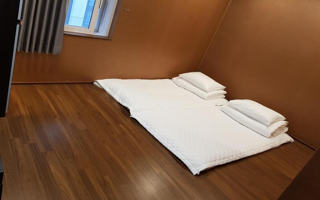 Postel nebo postele na pokoji v ubytování Soosong Guesthouse