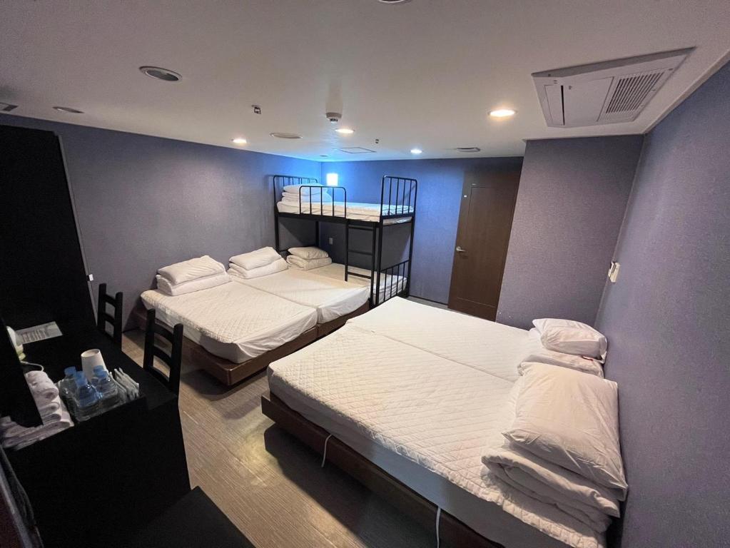 Postel nebo postele na pokoji v ubytování Soosong Guesthouse