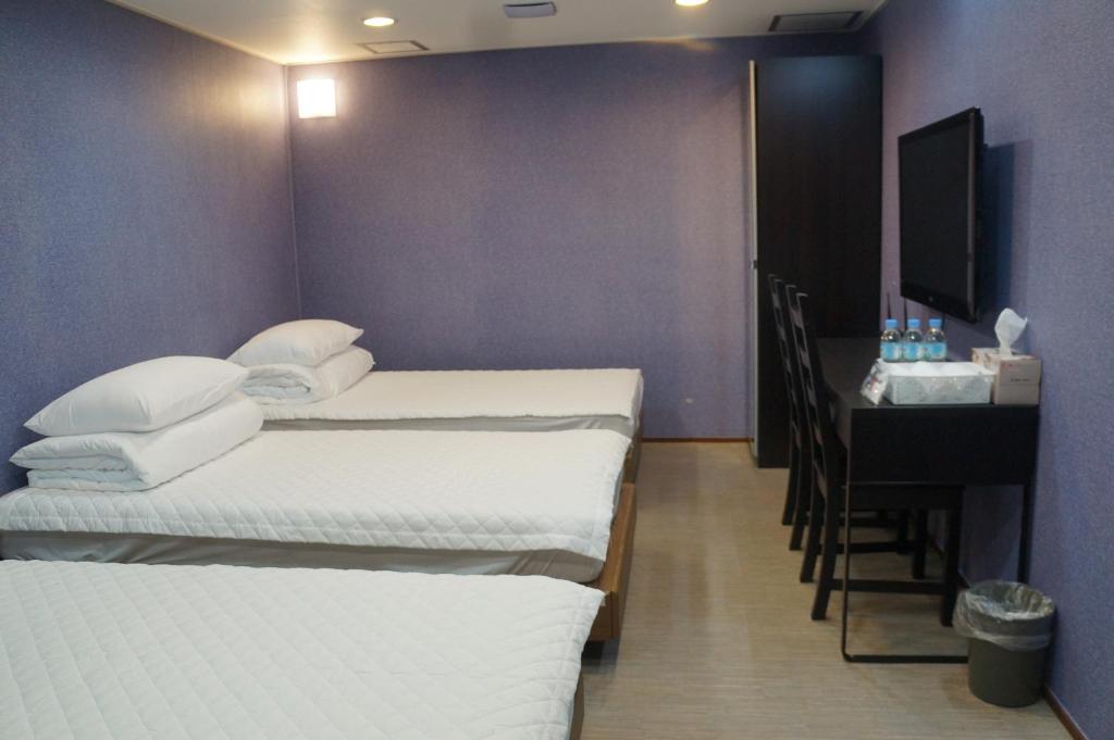 Postel nebo postele na pokoji v ubytování Soosong Guesthouse
