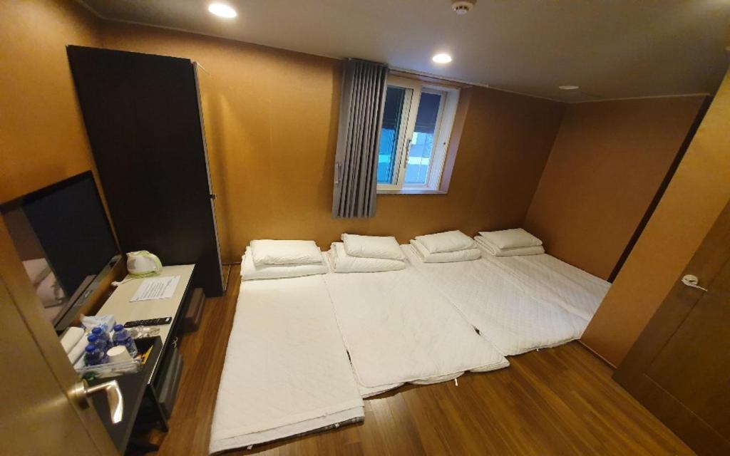 Postel nebo postele na pokoji v ubytování Soosong Guesthouse