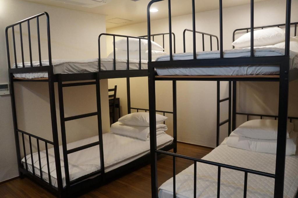 Postel nebo postele na pokoji v ubytování Soosong Guesthouse