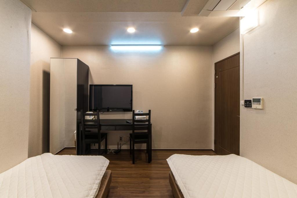 Postel nebo postele na pokoji v ubytování Soosong Guesthouse