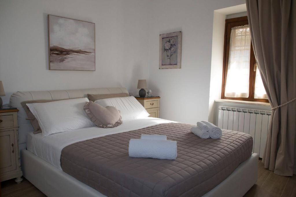 Łóżko lub łóżka w pokoju w obiekcie Residenza Porta Perlici Assisi Apartment