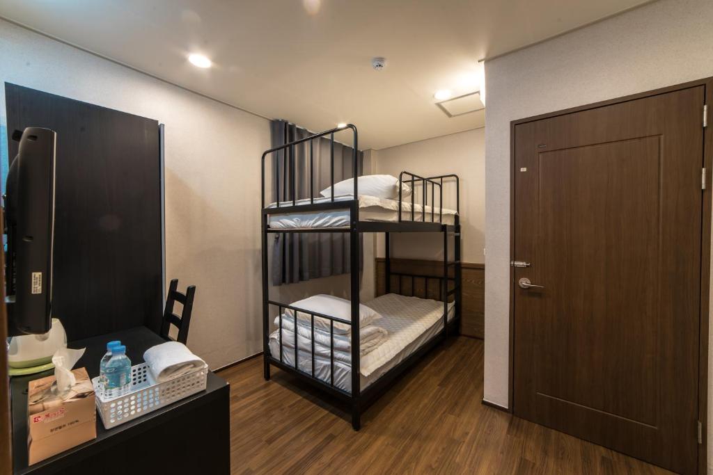 Postel nebo postele na pokoji v ubytování Soosong Guesthouse