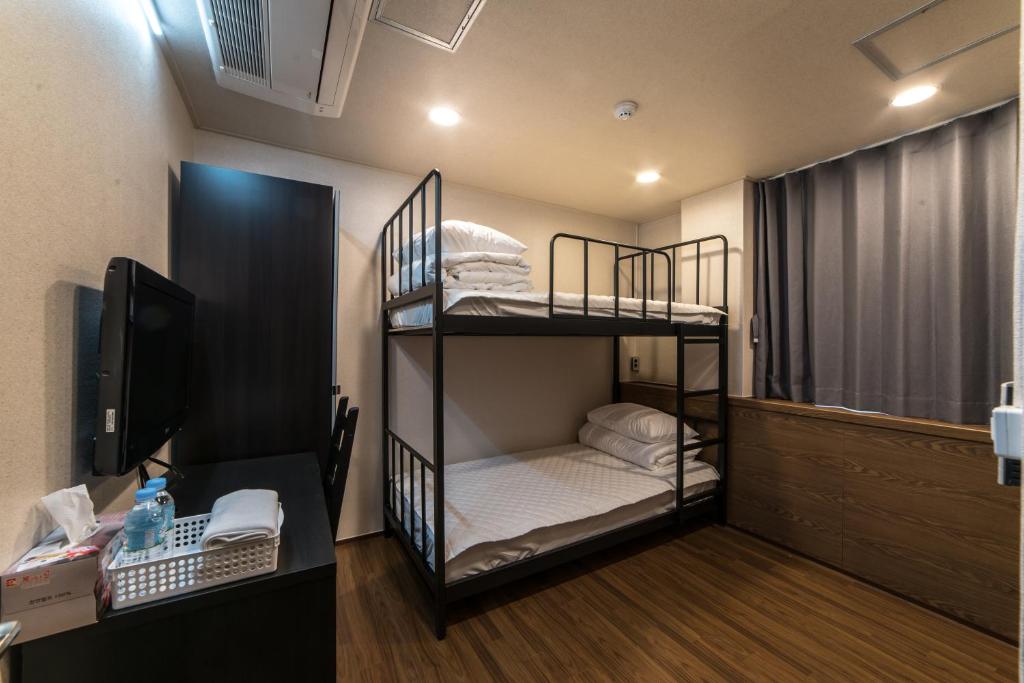 Postel nebo postele na pokoji v ubytování Soosong Guesthouse