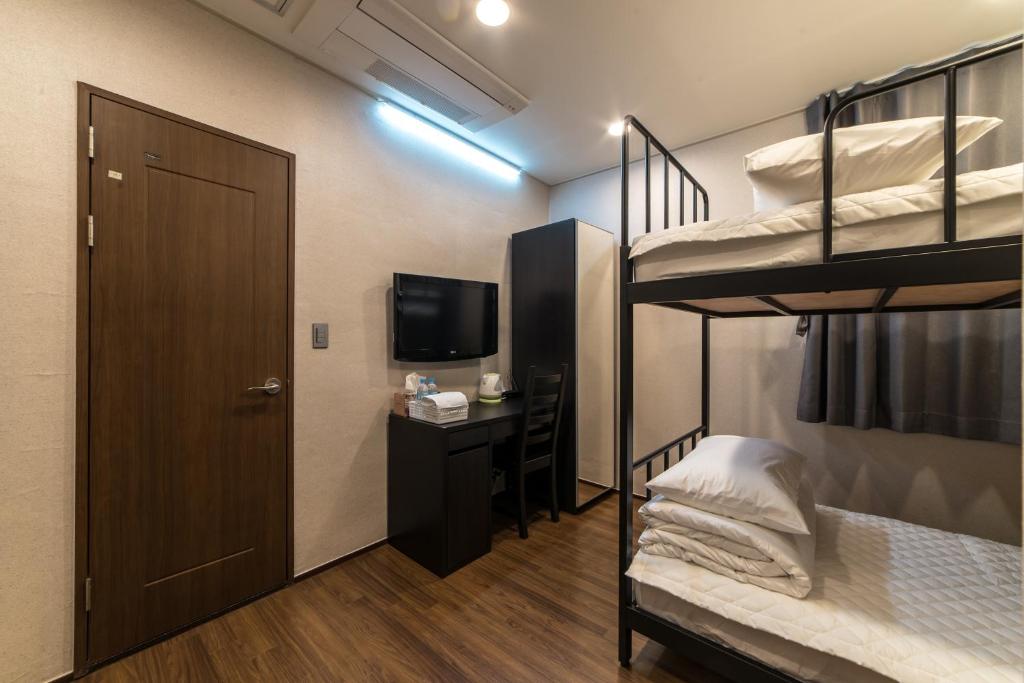 Postel nebo postele na pokoji v ubytování Soosong Guesthouse