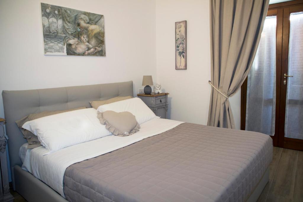 Łóżko lub łóżka w pokoju w obiekcie Residenza Porta Perlici Assisi Apartment