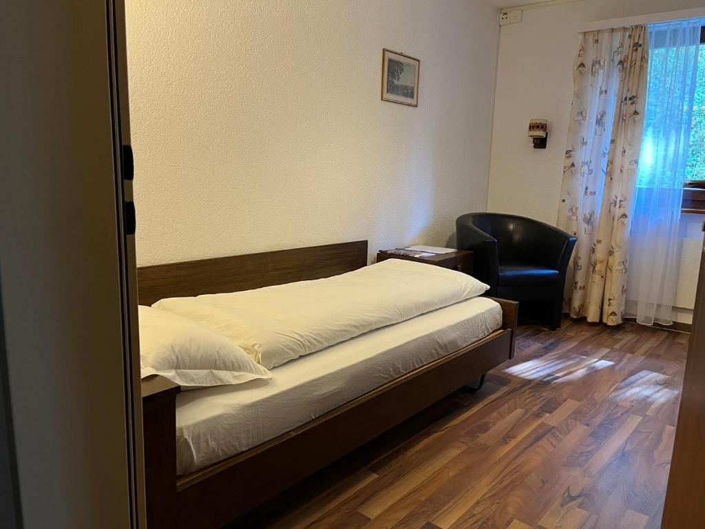 Postel nebo postele na pokoji v ubytování Hotel Gemmi