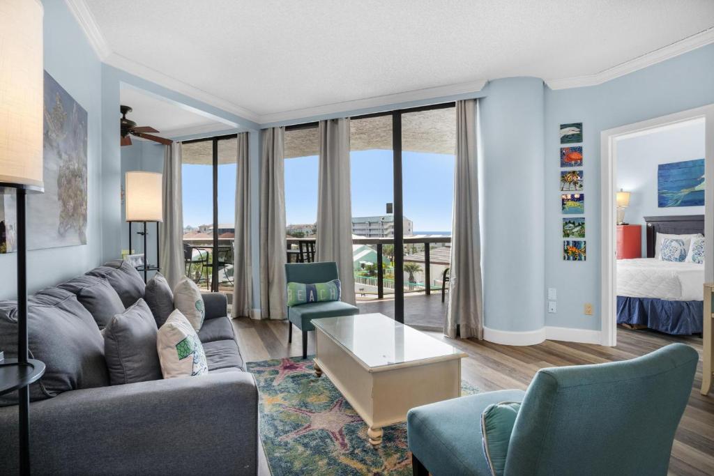 a living room with a couch and a bed at Surfside Resort #309 in Destin