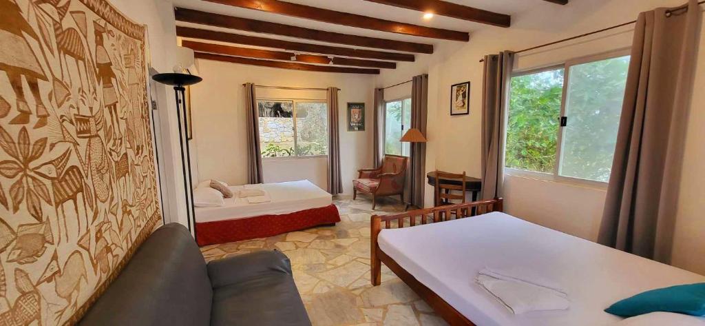 A bed or beds in a room at Coco Cabana Romblon
