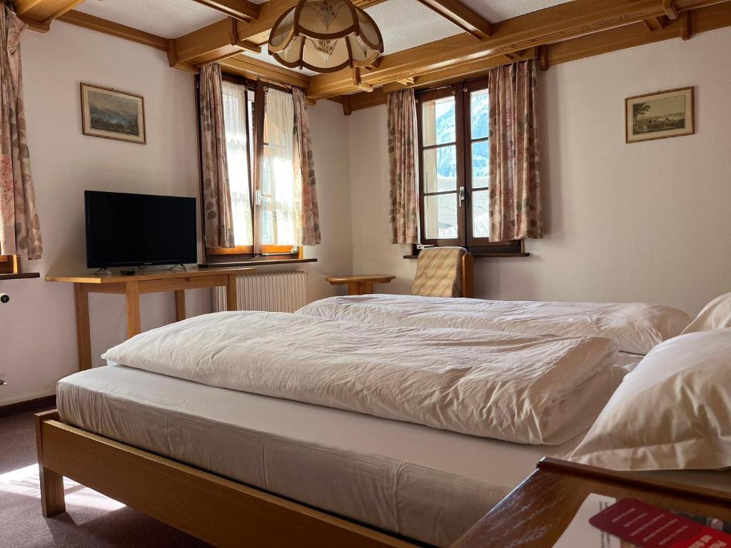 Postel nebo postele na pokoji v ubytování Hotel Gemmi