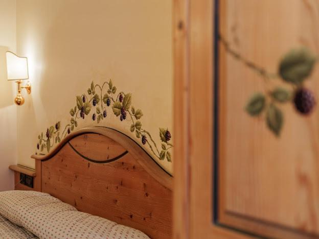 Postel nebo postele na pokoji v ubytování Hotel Garnì La Montanara